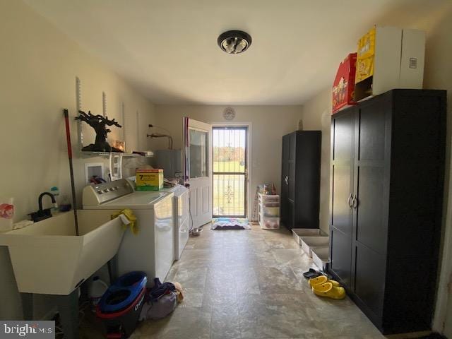 kitchen with sink and washing machine and dryer