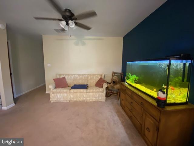 carpeted living room featuring ceiling fan