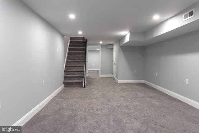 basement featuring carpet flooring