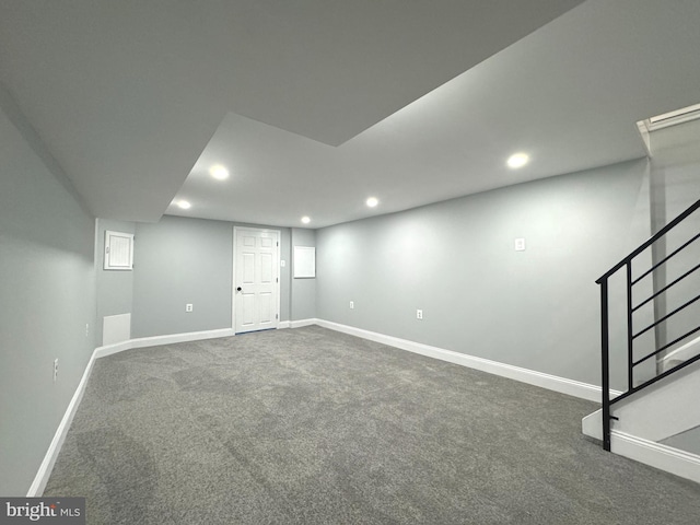 basement with dark carpet