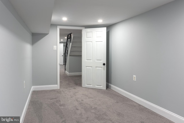 basement with light colored carpet