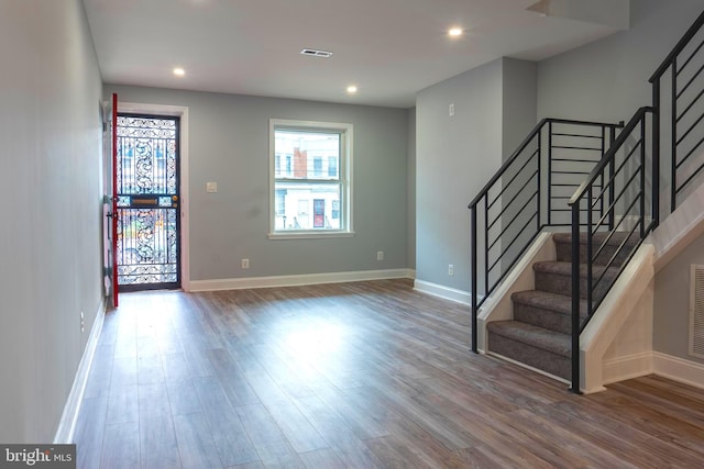 entrance foyer with hardwood / wood-style floors