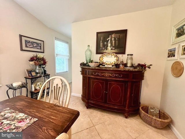 dining space featuring light tile patterned floors