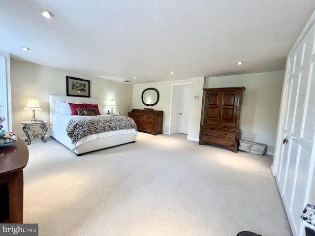 bedroom with light colored carpet