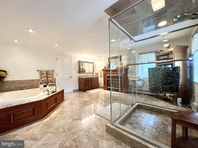 bathroom with plus walk in shower and vanity