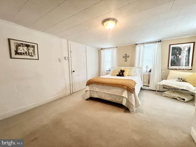 carpeted bedroom featuring crown molding