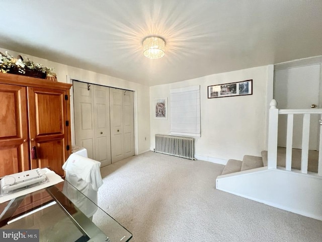 interior space featuring radiator and carpet