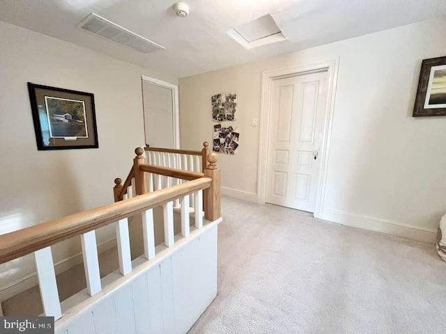 hallway with carpet floors