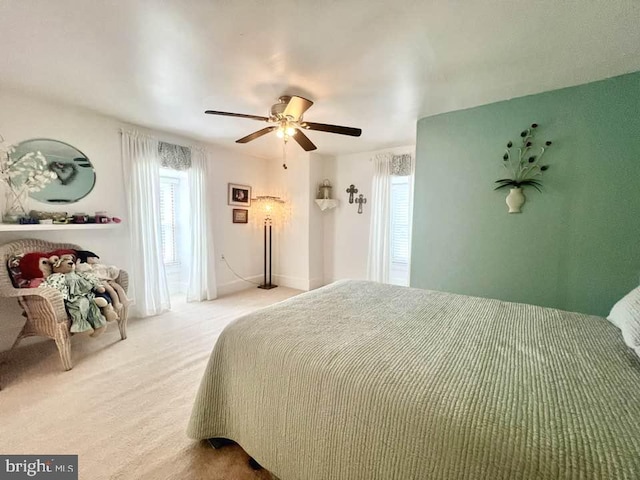 bedroom with ceiling fan and carpet floors