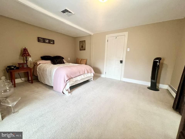 bedroom with carpet floors and a baseboard radiator