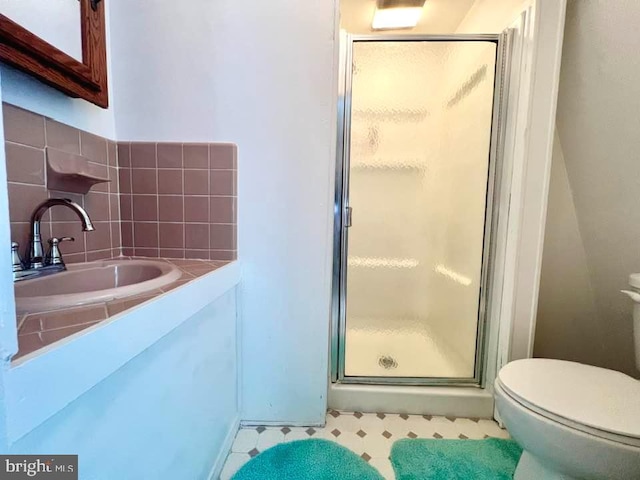 bathroom featuring vanity, tile patterned flooring, toilet, and an enclosed shower