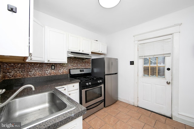 kitchen featuring backsplash, stainless steel appliances, white cabinetry, and sink