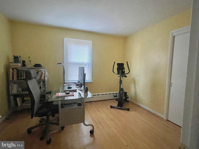 office area featuring a baseboard radiator and hardwood / wood-style floors