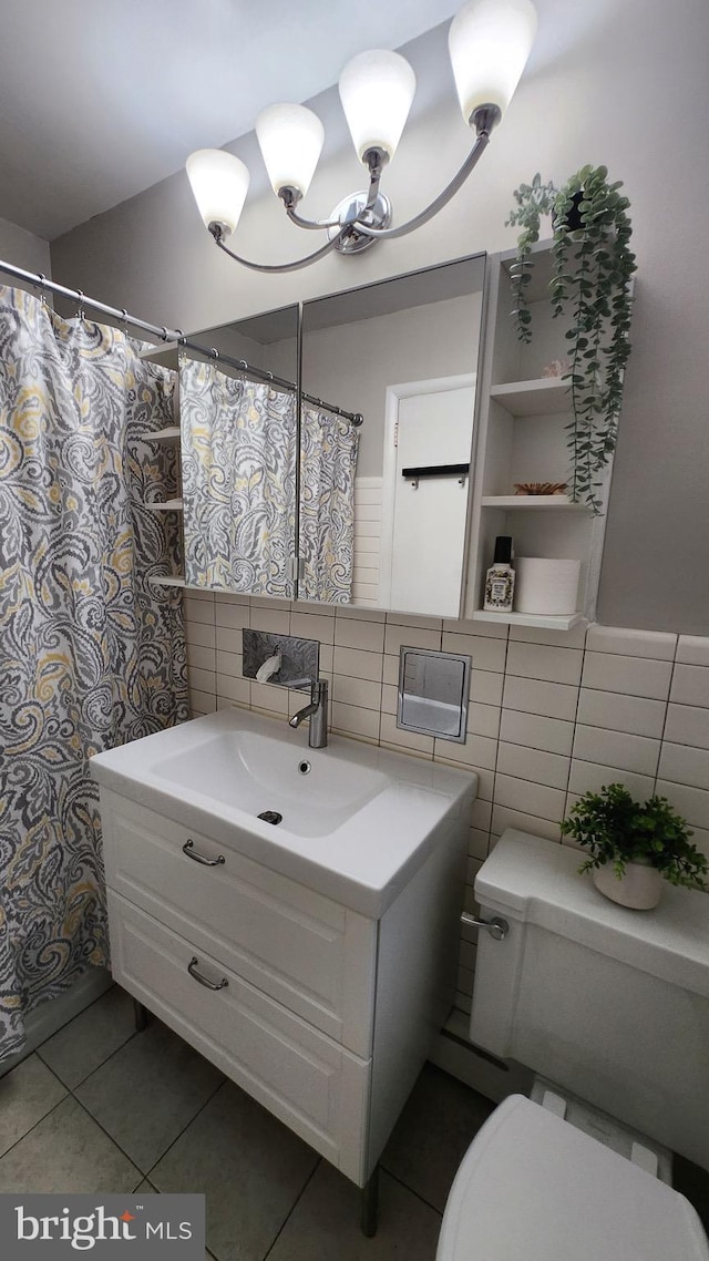 bathroom featuring tile walls, tile patterned floors, vanity, and toilet