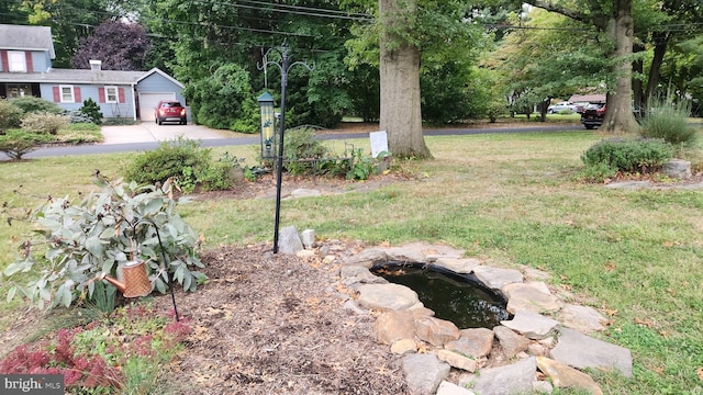 view of yard with a garage