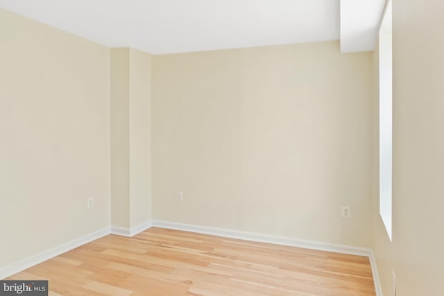 spare room with hardwood / wood-style flooring