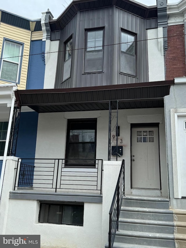 property entrance with covered porch