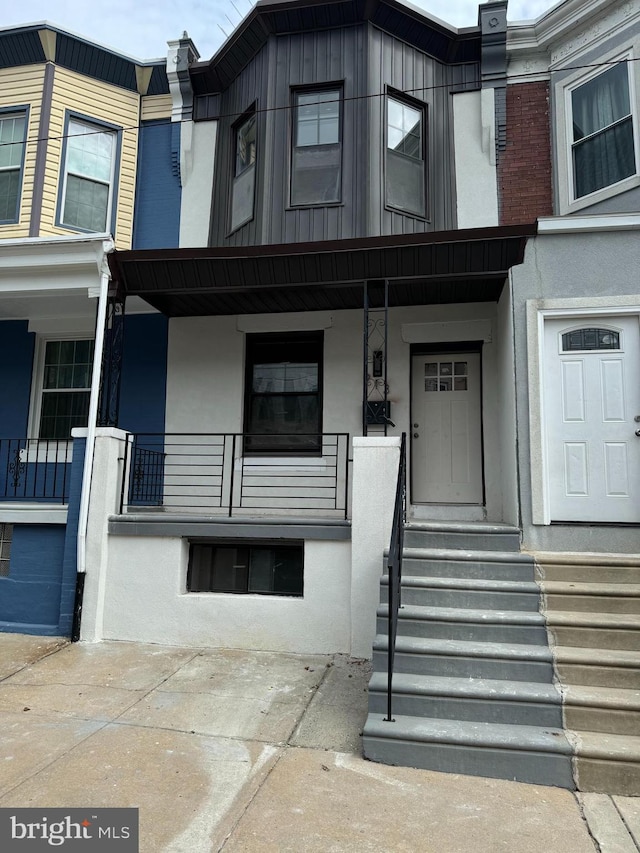 view of exterior entry with a porch