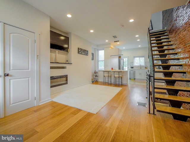 interior space featuring light wood-type flooring and sink