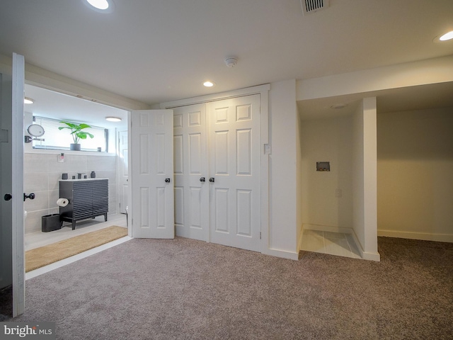 unfurnished bedroom with carpet flooring and a closet