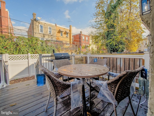 wooden deck with grilling area