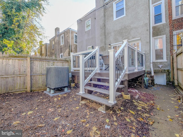 back of house featuring a wooden deck