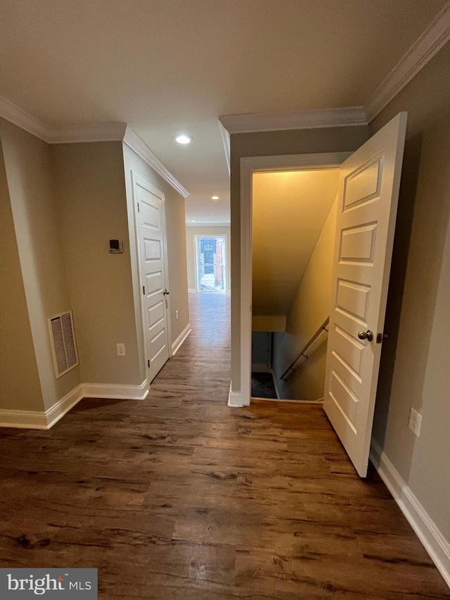 hall featuring dark hardwood / wood-style flooring and crown molding