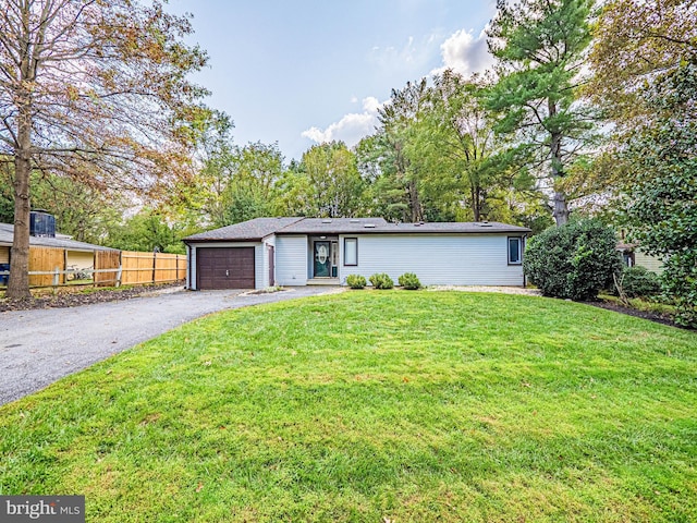 11512 Cherry Grove Dr, North Potomac, MD 20878 - view of front facade with a front yard, fence, a garage, and aphalt driveway