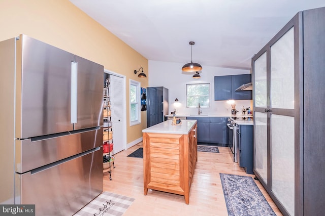 11512 Cherry Grove Dr, North Potomac, MD 20878 - kitchen with light wood finished floors, light countertops, stainless steel appliances, and a sink