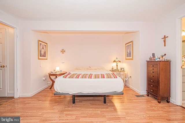 11512 Cherry Grove Dr, North Potomac, MD 20878 - bedroom with light wood-style floors, visible vents, and baseboards