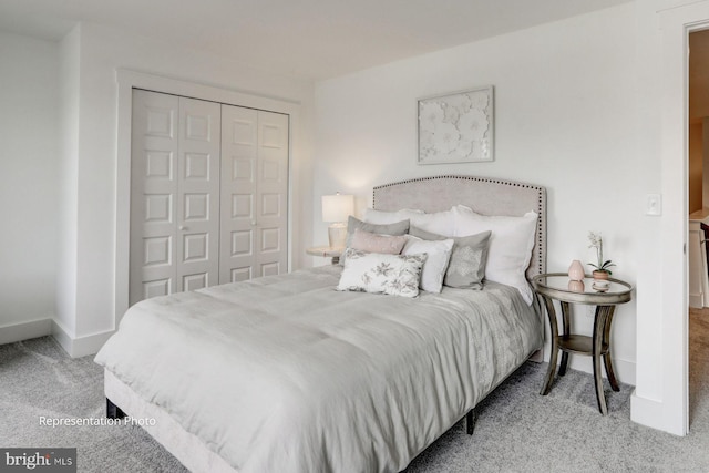 bedroom with carpet floors and a closet