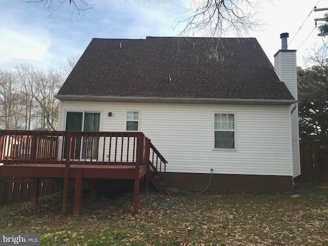 rear view of house with a wooden deck