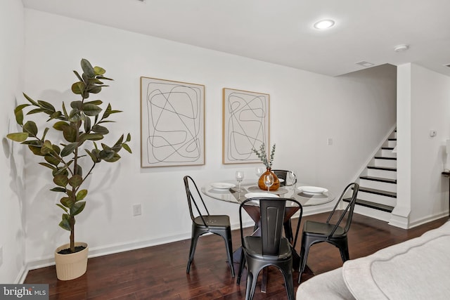 dining area with dark wood-type flooring