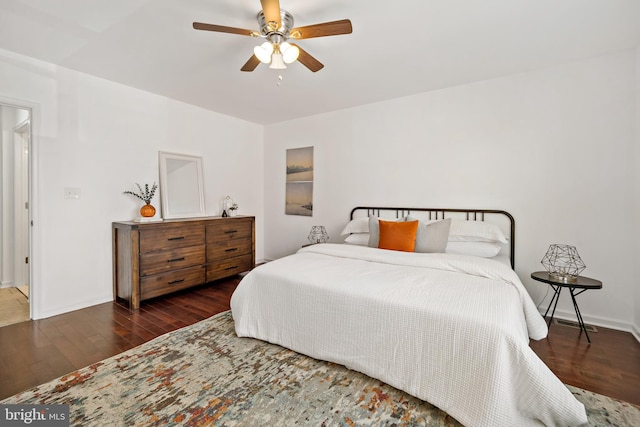 bedroom featuring ceiling fan and dark hardwood / wood-style flooring