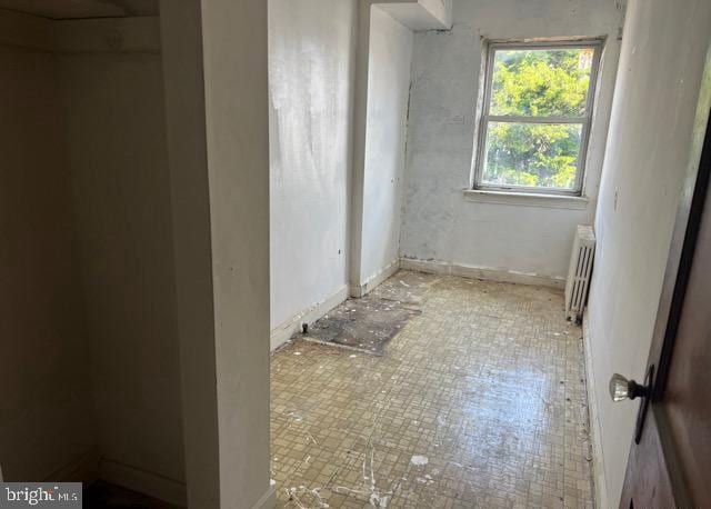 bathroom featuring radiator heating unit