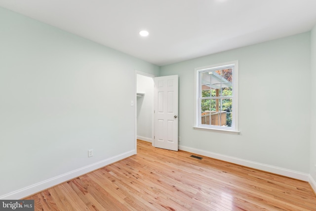 empty room with light wood-type flooring