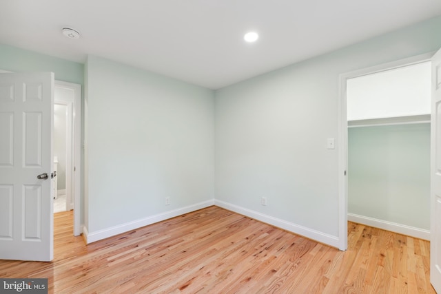 spare room with light hardwood / wood-style floors