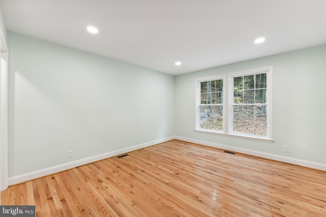 spare room with light hardwood / wood-style floors