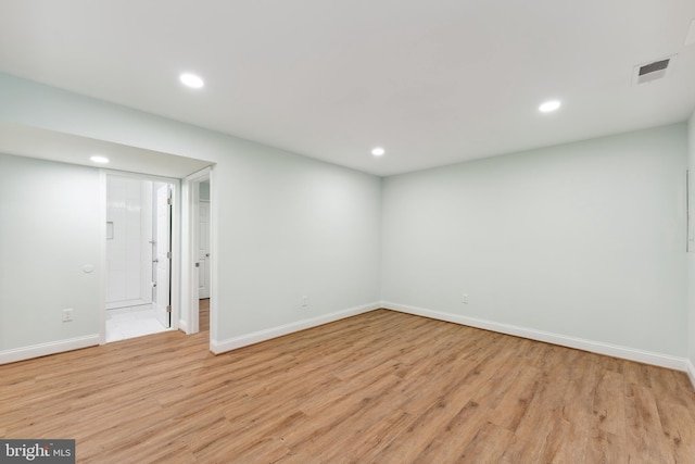 spare room featuring light hardwood / wood-style floors