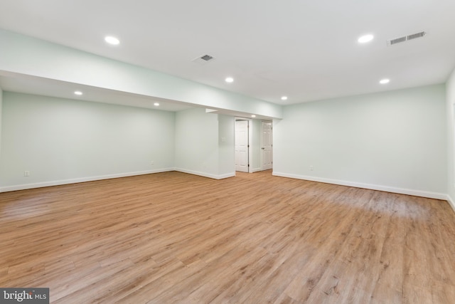 basement featuring light wood-type flooring