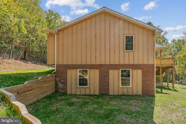 exterior space with a yard and a wooden deck