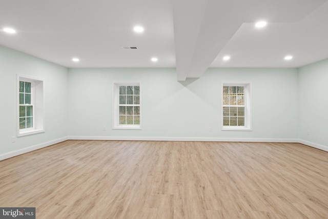 basement featuring light hardwood / wood-style flooring