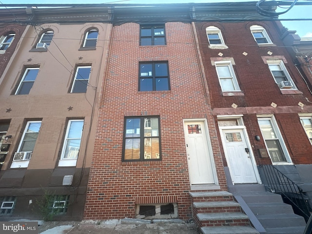 view of front of home featuring cooling unit