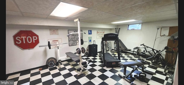 exercise area featuring a drop ceiling