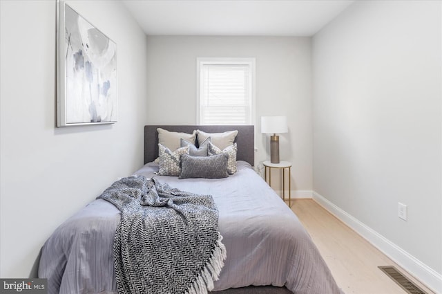 bedroom with light wood-type flooring