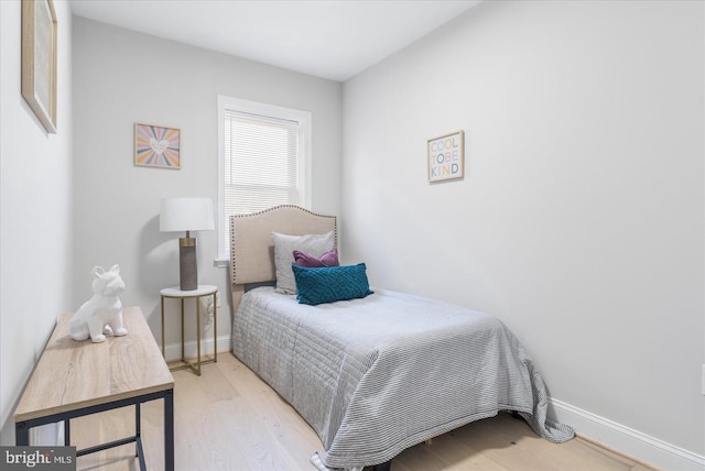 bedroom with light wood-type flooring