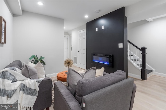 living room with light hardwood / wood-style flooring