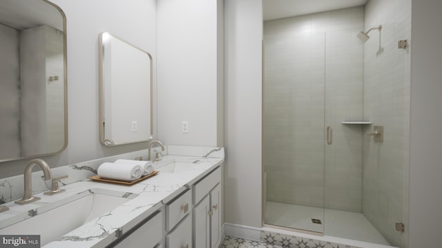 bathroom with walk in shower and vanity