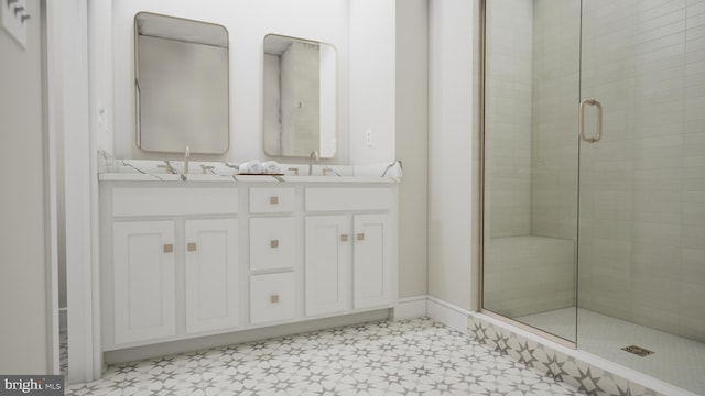 bathroom featuring vanity and a shower with shower door