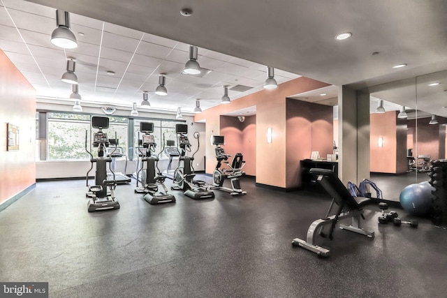 exercise room featuring a drop ceiling